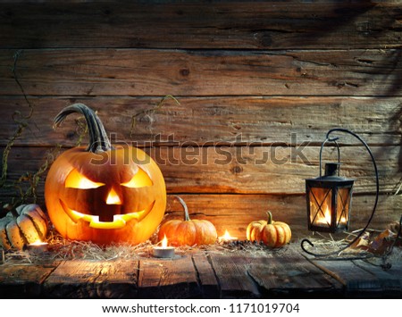 Halloween Pumpkins In Rustic Background With Lantern