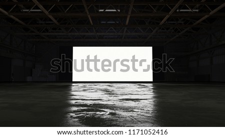 3d rendering of dark empty factory interior or empty warehouse, a glowing white screen in the middle Royalty-Free Stock Photo #1171052416