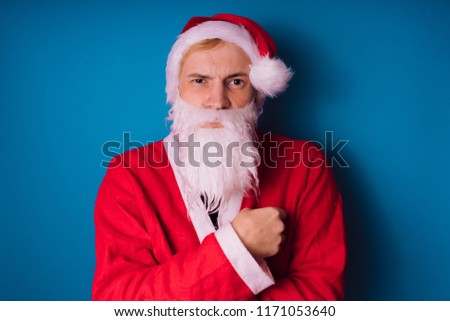 Santa Claus on a blue background. Happy New Year and merry Christmas!
