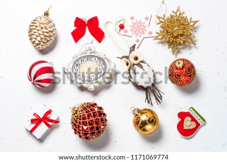 Christmas background. Different christmas toys and decorations on white marble table. Top view.