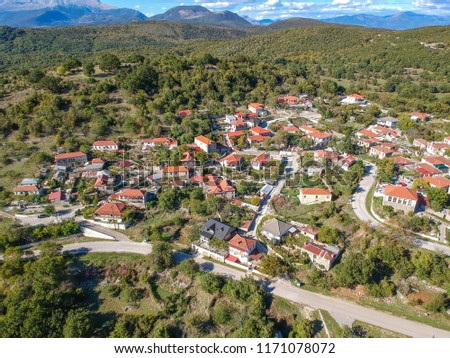 Aerial panoramic view of the picturesque village Mesovouni Located near Aristi village in Epirus, Greece. Scenic aerial view of traditional Greek villages in Autumn. Epirus, Greece, Europe. Royalty-Free Stock Photo #1171078072