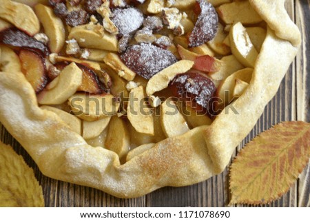 Homemade galette with apples plums and nuts