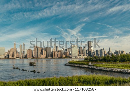 NYC midtown skyline with lots of greens from Long Island City in early summer morning