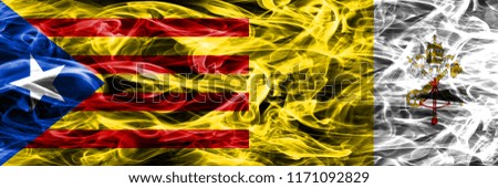 Catalonia vs Vatican city copy smoke flags placed side by side. Thick colored silky smoke flags of Catalan and Vatican city copy