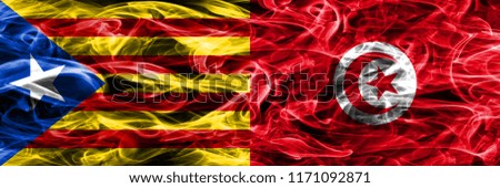 Catalonia vs Tunisia copy smoke flags placed side by side. Thick colored silky smoke flags of Catalan and Tunisia copy