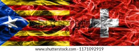 Catalonia vs Switzerland copy smoke flags placed side by side. Thick colored silky smoke flags of Catalan and Switzerland copy