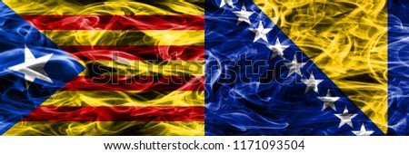 Catalonia vs Bosnia and Herzegovina copy smoke flags placed side by side. Thick colored silky smoke flags of Catalan and Bosnia and Herzegovina copy
