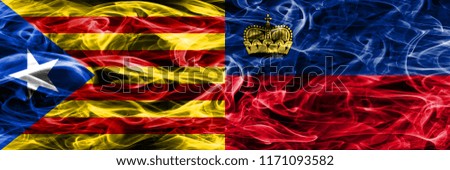 Catalonia vs Liechtenstein copy smoke flags placed side by side. Thick colored silky smoke flags of Catalan and Liechtenstein copy