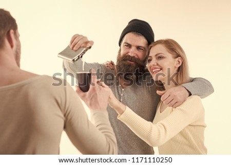 happy young people , drinking alcohol, close up hands toasting, having fun, friends home party, hipster company together, two men one woman, smiling, positive, relaxed, hang out, laughing