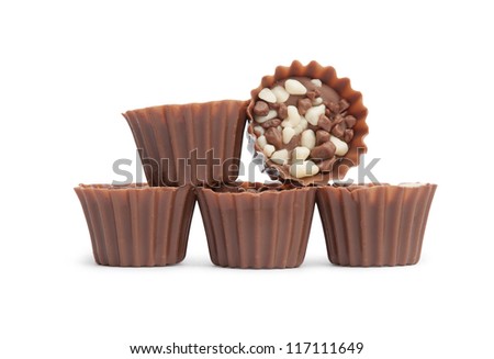 Mixed Chocolates heap against a white background (candy basket)