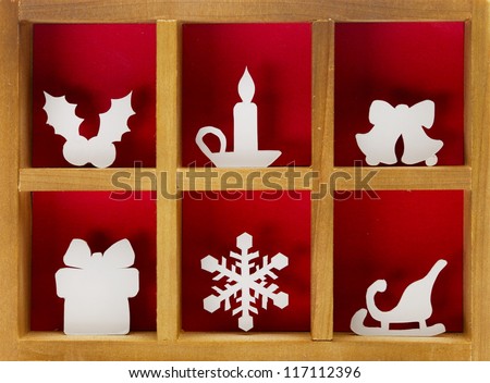Christmas decoration hand cut and crafted from paper, wooden printer tray.