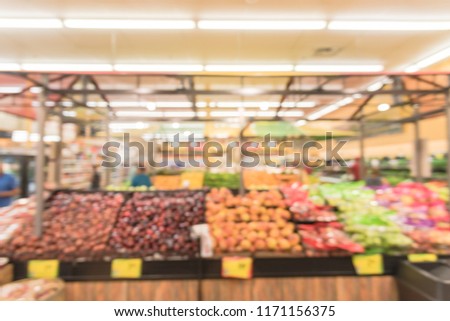 Blurred image people shopping at local Latino-American supermarket chain in USA. Customer buying fresh fruits, vegetables. Organic locally grown produces on display. Healthy food in grocery store
