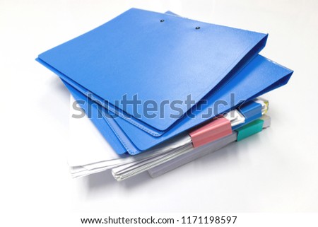 Blue files folder and paper on white table in office, concept Office supplies