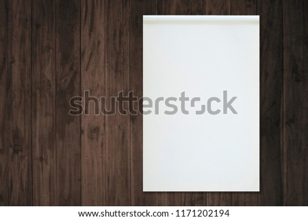 Blank white paper notebook on old grudge wooden table.