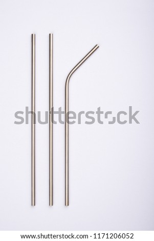 reusable stainless steel straws, isolated on white Royalty-Free Stock Photo #1171206052