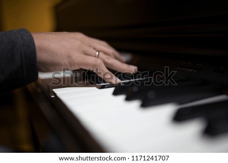 Piano and human hands