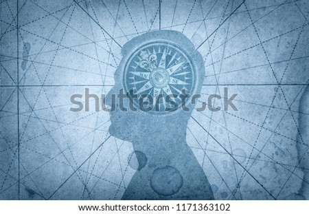 Human head and compass. The concept on the topic of navigation, psychology, morality, etc. Royalty-Free Stock Photo #1171363102