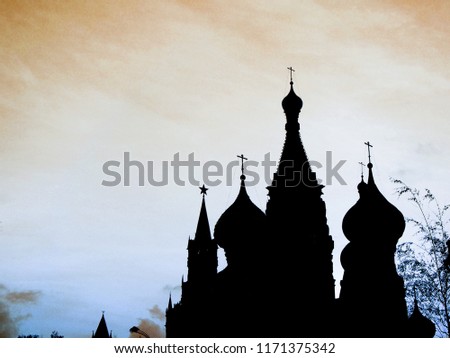 Black silhouettes of the towers of the Moscow Kremlin and St. Basil