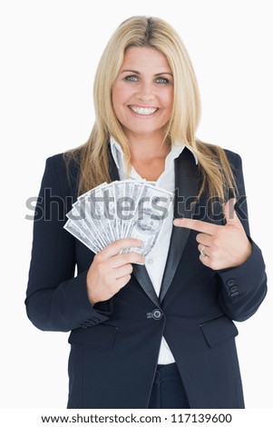 Happy Well-dressed woman holding dollars in the white background
