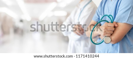 Surgeon and anesthetist doctor ER surgical team with medical clinic room background for emergency nursing care professional teamwork and patient trust in ICU hospital's hospitality concept  Royalty-Free Stock Photo #1171410244