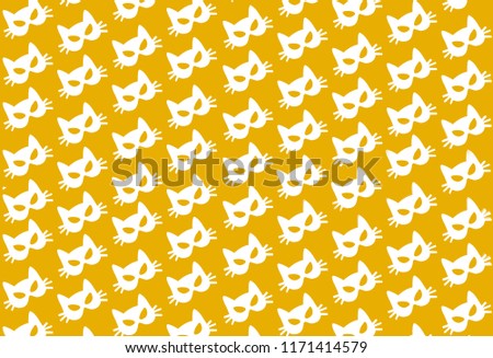 white paper cat mask pattern on yellow background. Halloween, carnival, masquerade concept