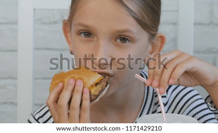 Child Eating Hamburger Drinking Juice in Restaurant, Kid and Fast Food, Children