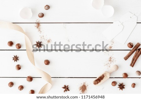 Baking ingredients for pastry on the white table. Flat lay, top view with copy space for your text, lettering or recipe. Homemade recipe. Tender background for food bloggers, headers and magazines.