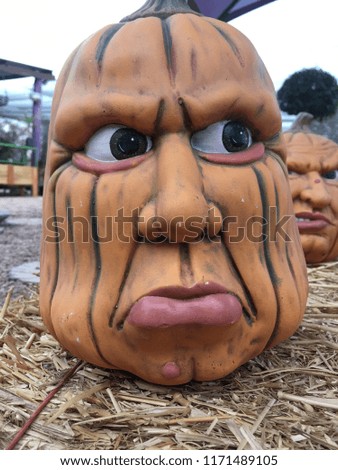 Ceramic Pumpkin Head on a Straw Bale