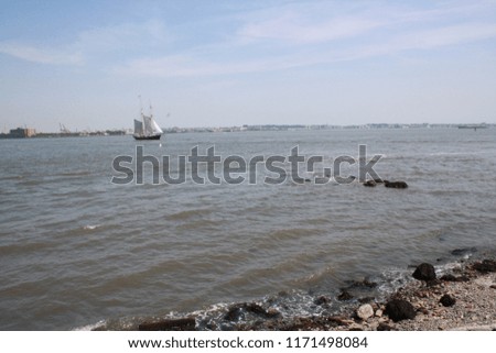 river and a sailboat