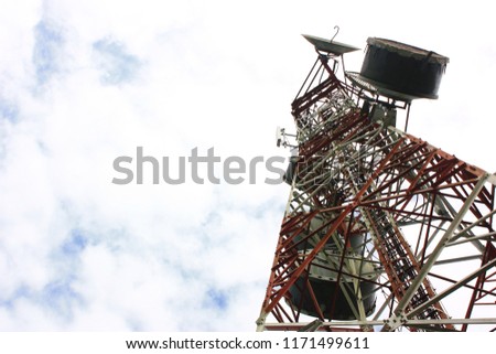 Communication tower with cloud sky background 