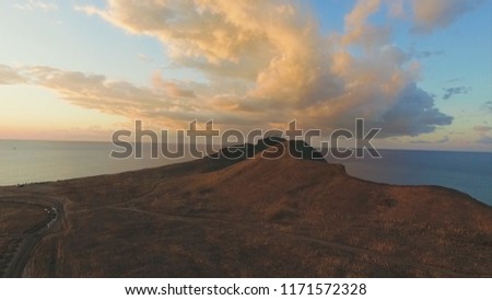 Top view of beautiful sea landscape in mountains at sunset. Shot. Concept of peace and harmony