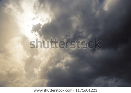 Sun crossing through clouds