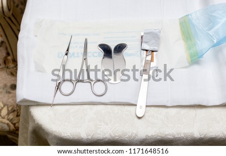 Tools for circumcision. Scissors. knife. And protector Royalty-Free Stock Photo #1171648516