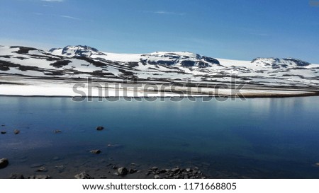 Beautiful peaceful Scandinavian landscape and snow mountains in Norway 