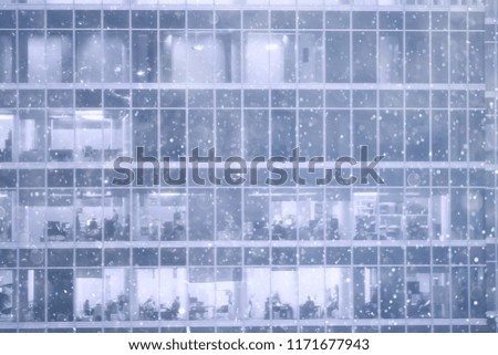 snow in a night city skyscrapers / seasonal landscape winter city, snowfall against a background of skyscrapers
