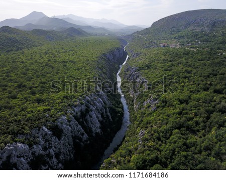 The Cetina River is entrenched into one of the deepest and narrowest canyons in the world. It is positioned in the central Dalmatia, Croatia, close to Omiš. Royalty-Free Stock Photo #1171684186