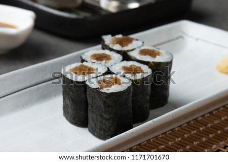 tuna maki sushi roll with background