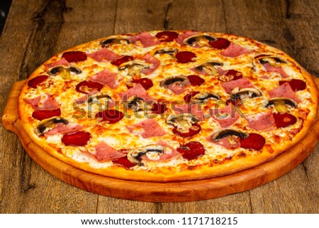 Pizza with sausages and cheese