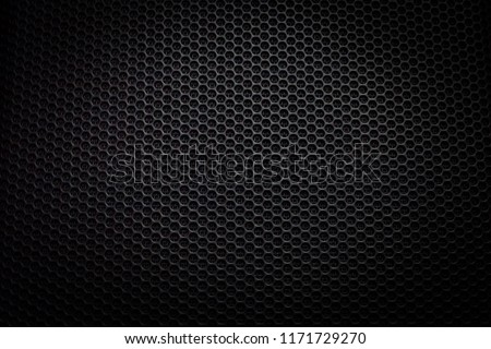Abstract black metallic mesh texture pattern for background. Industrial backdrop. The speaker of a musical column. Free space for text. Royalty-Free Stock Photo #1171729270