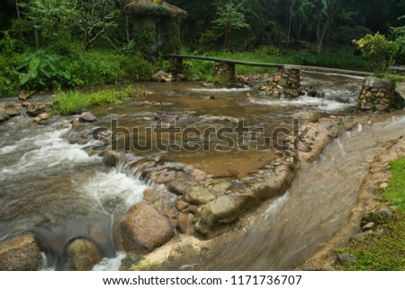 Waterfalls flowing down from the stream at "Than Thong" waterfalls in Chiangmai, Thailand
