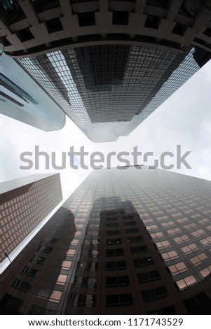 Skyscrapers seen from the ground up. Sky Scrapers photographed through a Fish Eye lens. Downtown buildings in any large city. Los Angeles, Chicago, New York, Tokyo.
