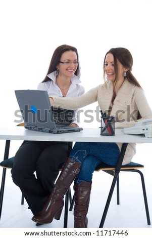 Two business woman work with laptop on white