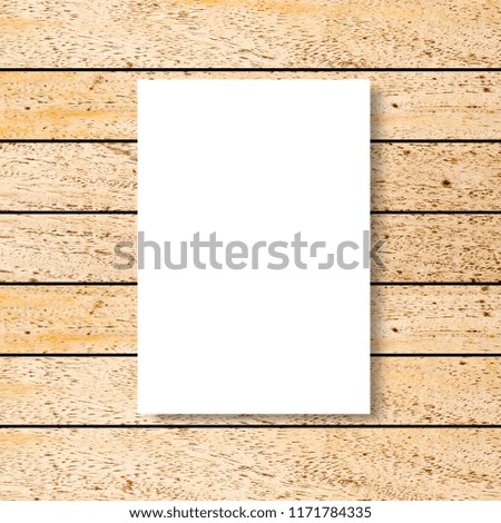 mock up white poster frame on vintage brown wood carpentry background texture for design and decorate interior concept