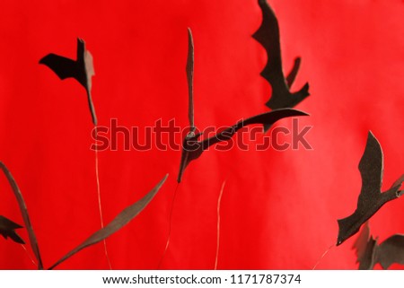 photo of decorative bats on a red background