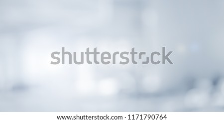 abstract blurry loft cozy interior office workplace background with light window effect for banner , ads design