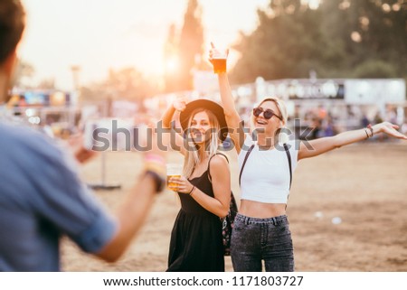 Man taking picture of female friends