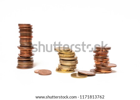some stacked euro coins on a white surface