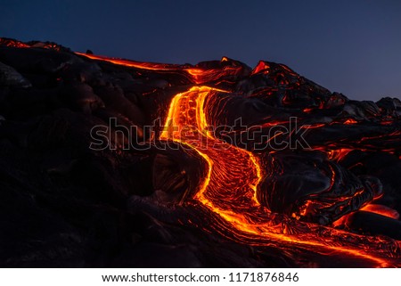 River of pahoehoe lava flowing down a cliff Royalty-Free Stock Photo #1171876846