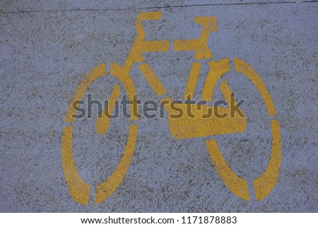Yellow bicycle design on cycle way