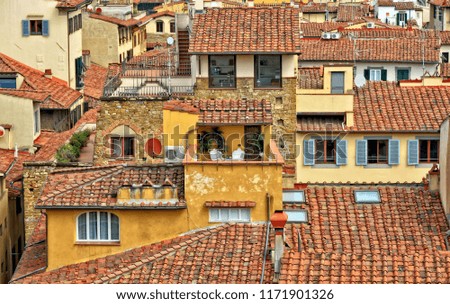 Housing in West Europe. Accommodation in the city. Densely located buildings with nice red tile roofs, air-conditioners and satellite dishes. Urban landscape. 